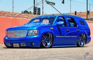 Dropped Royal Blue Chevy Tahoe on Color Matched Wheels