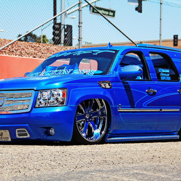 Lowered Blue Chevy Tahoe on Custom Lexani Wheels - Photo by Lexani