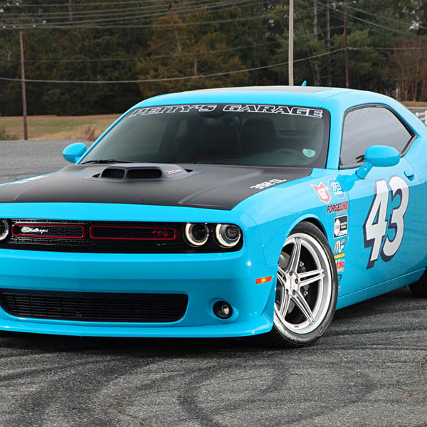 Blue Debadged Dodge Challenger with Custom Halo Headlights - Photo by Forgeline Motorsports