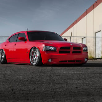 Red Dodge Charger Slammed to the Ground - Photo by Avant Garde