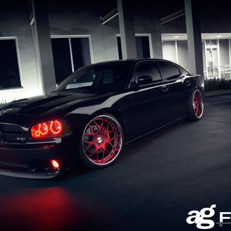 Avant Garde Red Custom Wheels with Polished Lips on Black Charger - Photo by Avant Garde