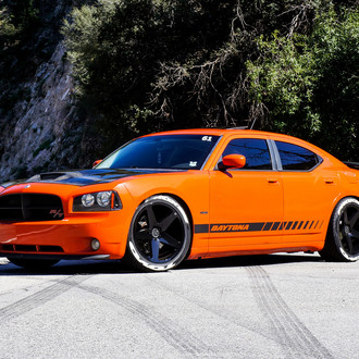 Bright Orange Dodge Charger with Contrasting Black Accents