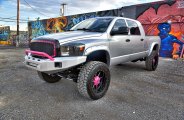 Stylish Lifted Gray Dodge Ram Featuring Pink Accents