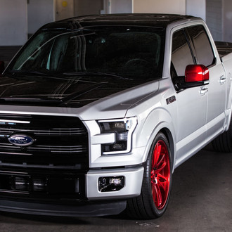 Lowered Black Top Ford F150 on Red Custom Wheels - Photo by CGS Performance