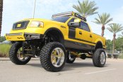 Boss 302 Style Painted F150 With a Lift and Large Tires