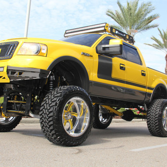 Boss 302 Style Painted F150 With a Lift and Large Tires - Photo by American Force