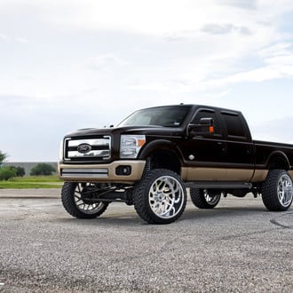 Black Ford F-250 Super Duty with Chrome Grille - Photo by Fuel Offroad