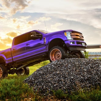 Purple Lifted Ford F-250 with Custom Copper Grille - Photo by Fuel Offroad