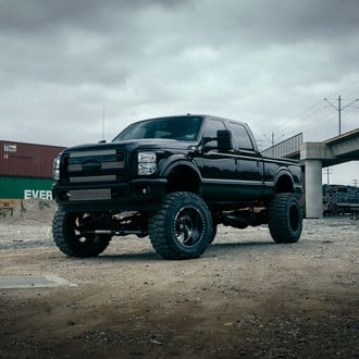 Black Ford F-350 with Custom Main and Bumper Grilles - Photo by Fuel Offroad