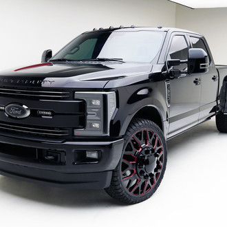 Black Ford F350 With Black Grille And Custom Painted Rims - Photo by MAD Industries