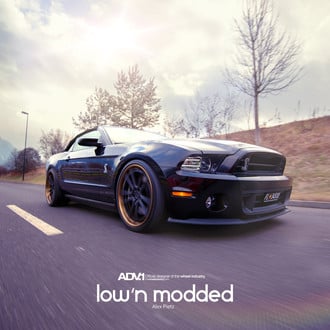 Aftermarket Front Lip on Black Ford Mustang - Photo by ADV.1