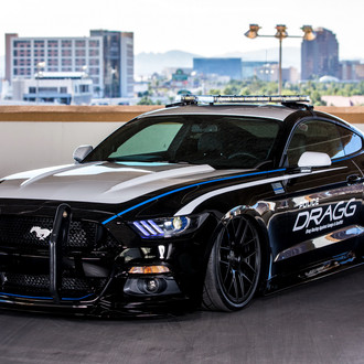 Black Mustang Interceptor With a Push Bar and Air Suspension - Photo by DRAGG