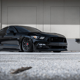 Black Ford Mustang with Aftermarket Headlights - Photo by Vorstiner