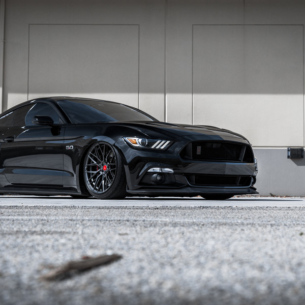 Black Ford Mustang with Aftermarket Headlights - Photo by Vorstiner