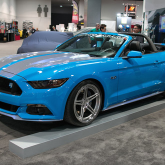 Blue Convertible Ford Mustang with Aftermarket Body Kit - Photo by Forgeline Motorsports