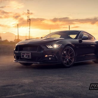 Black Ford Mustang 5.0 with Aftermarket Headlights - Photo by PT works