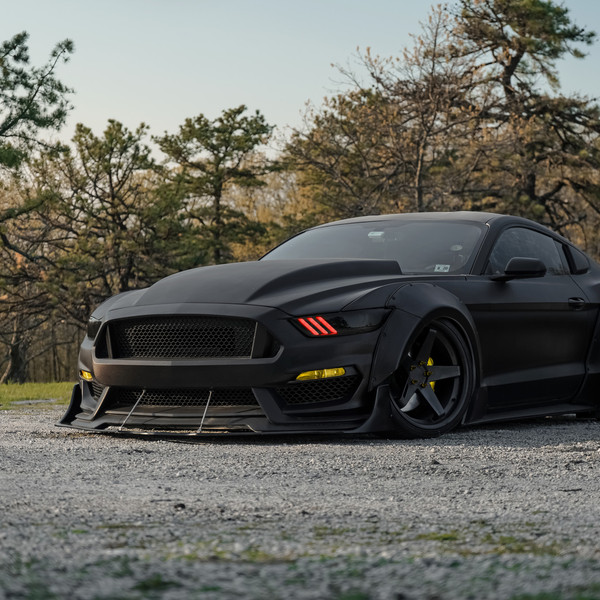 Custom Matte Black Ford Mustang with Liberty Walk Body Kit - Photo by Blaque Diamond Wheels