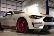 Red Body Accents and Wheels on White Ford Mustang Making It Stand Out