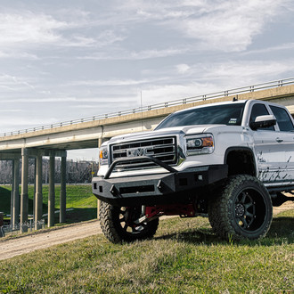 Purpose Built Lifted GMC Sierra on 37 inch Toyo M/T Tires - Photo by Black Rhino