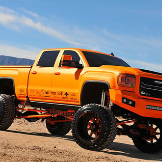 American Force Custom Wheels on Orange GMC Sierra - Photo by Phil Gordon