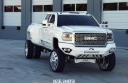 Modified GMC Sierra Sitting on Chrome American Force Wheels