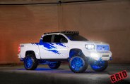 Mall Crawler White Lifted GMC Sierra Rocking Blue Grid Off-Road Rims