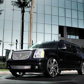 Black GMC Yukon XL with Chrome Lexani Wheels - Photo by Lexani
