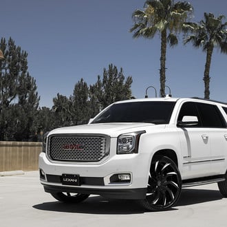 White GMC Yukon on Contrasting Multispoke Lexani Wheels