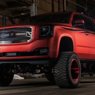 Lifted GMC Yukon With Chrome Red Vinyl Wrap - Photo by Dale Martin