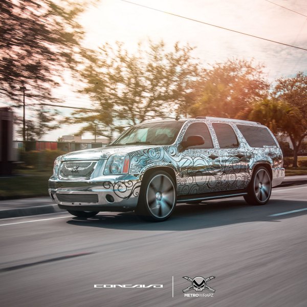 Tattooed GMC Yukon With a Chrome Wrap and Concavo Rims - Photo by Concavo