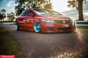 JDM Red Honda Civic with Nice Stance and Blue Rims