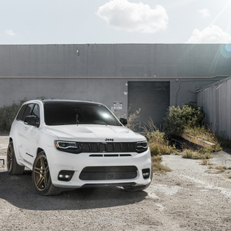 White Jeep Grand Cherokee with Custom Headlights - Photo by Velgen Wheels