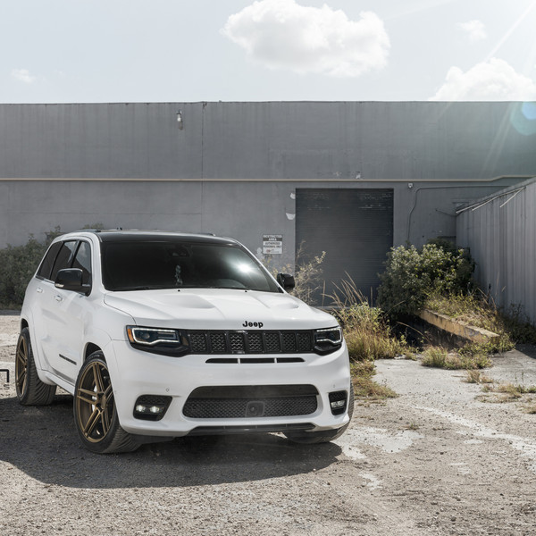 White Jeep Grand Cherokee with Custom Headlights - Photo by Velgen Wheels