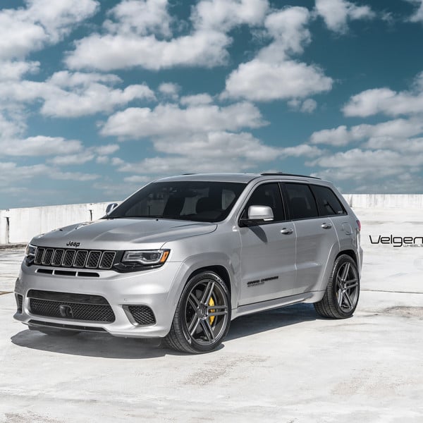 Silver Jeep Grand Cherokee with Aftermarket Headlights - Photo by Velgen