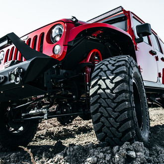 Warn Front Bumper with LED Light Bar on Jeep Wrangler - Photo by Rebel Off-Road