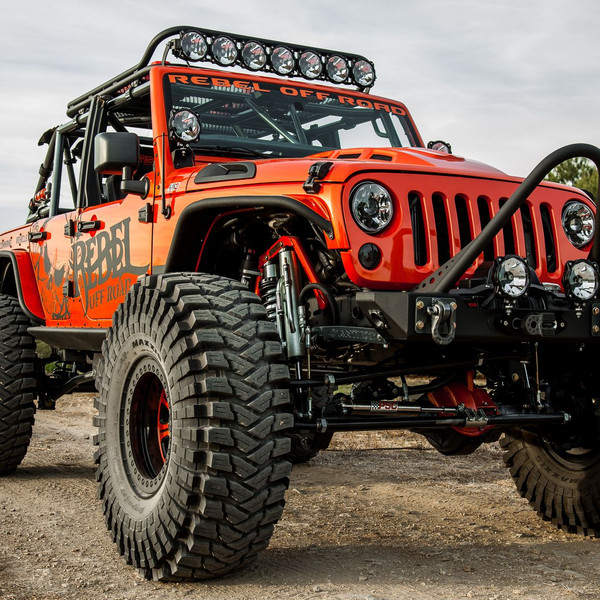 Dark Smoke Headlights on Orange Lifted Jeep Wrangler - Photo by Rebel Off-Road