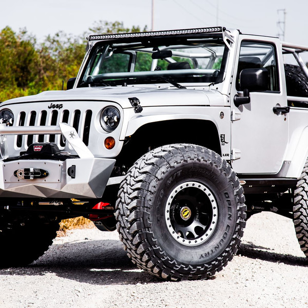 White Lifted Jeep Wrangler with Custom Front Bumper - Photo by Rebel Off-Road