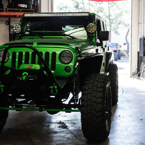Green Lifted Jeep Wrangler with Custom Vented Hood - Photo by Rebel Off-Road