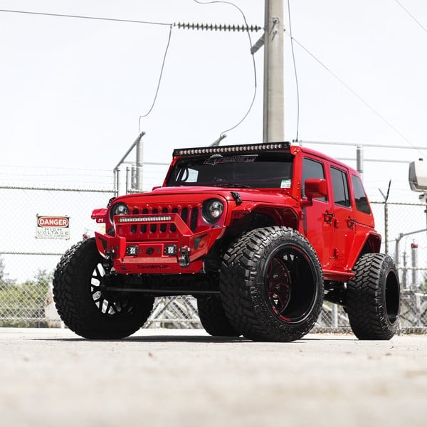 Red Jeep Wrnagler on Huge Off-road Wheels - Photo by Fuel Off-Road