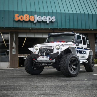 Off-road Modified Jeep Wrangler With Police Vinyl Wrap - Photo by Fuel Off-Road