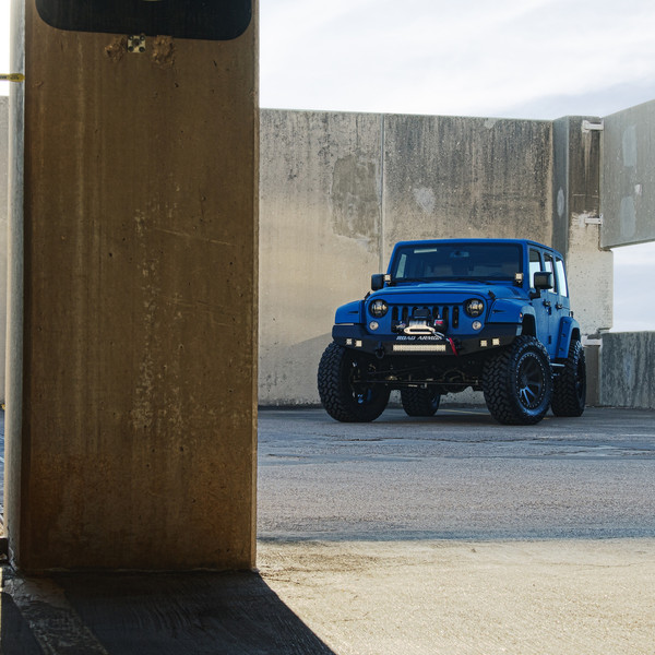 Blue JK With Protective Body Coating on 35 Inch Off-road Tires - Photo by Black Rhino