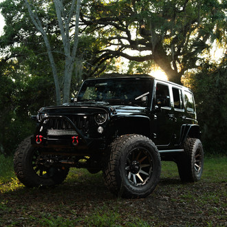 Grid Off-road Jeep Wrangler With Cut-Out Fenders and Toyo Mud Tires - Photo by Grid Off-road