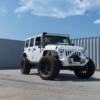 Custom Front Bumper with Tow Hooks on Jeep Wrangler - Photo by Fuel Offroad