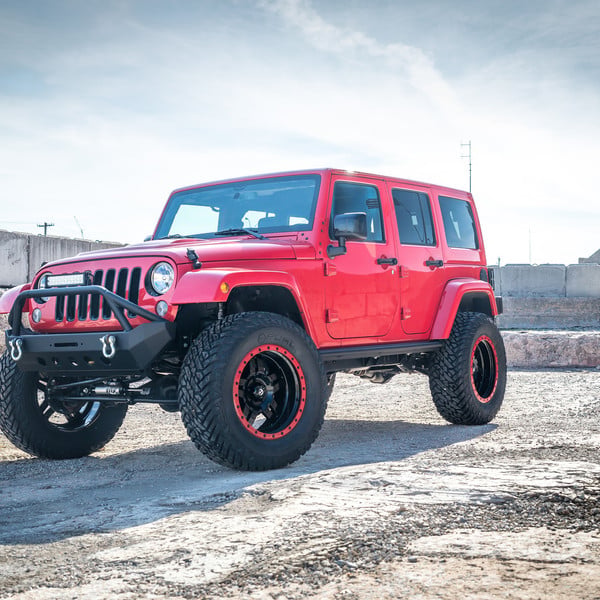 Custom Lifted Red Jeep Wrangler with Fox Shocks - Photo by Fuel Offroad