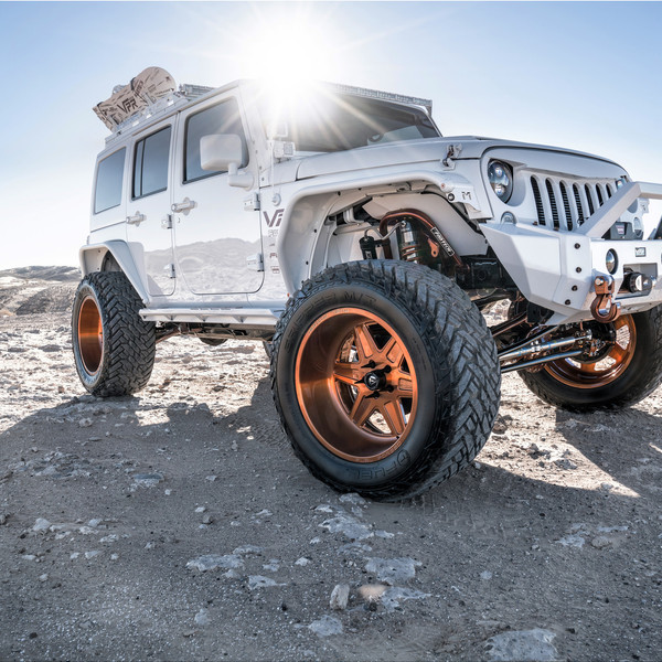 White Jeep Wrangler with Custom Fabtech Suspension System - Photo by Fuel Offroad