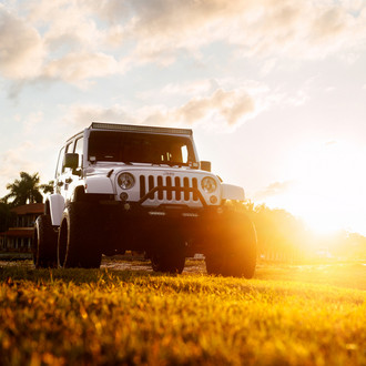White Jeep Wrangler with Custom Grille Guard - Photo by Fuel Offroad