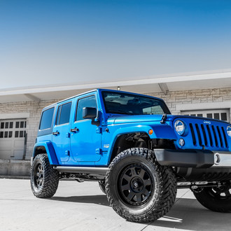 Blue Jeep Wrangler with Pro Comp Lift Kit - Photo by Fuel Offroad