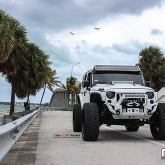 White Jeep Wrangler with Custom Off-road Winch Front Bumper - Photo by Vellano
