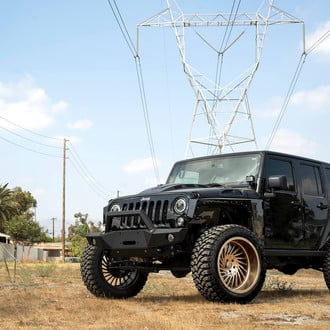 Black Jeep Wrangler with Off-road Winch Front Bumper - Photo by Forgiato