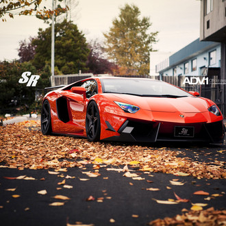 Custom Front Bumper on Orange Lamborghini Aventador - Photo by ADV.1